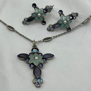 Mary Demarco gemmed cross and pierced earrings.